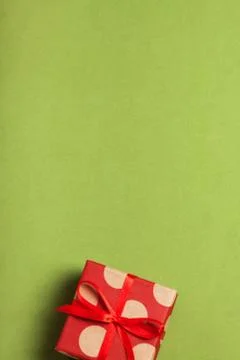 A gift in a box on a greenery background Foto stock