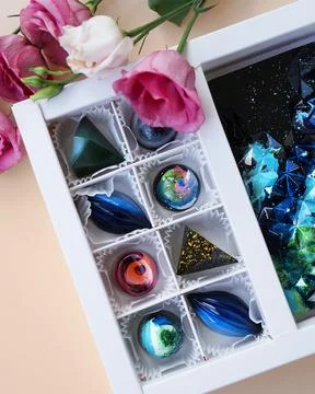 Gift box of handmade chocolates. Geometric and space design Stock Photos