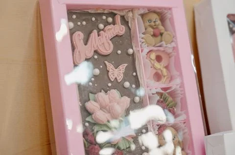 A gift box with handmade teddy bear-shaped chocolates and decorative elements Stock Photos