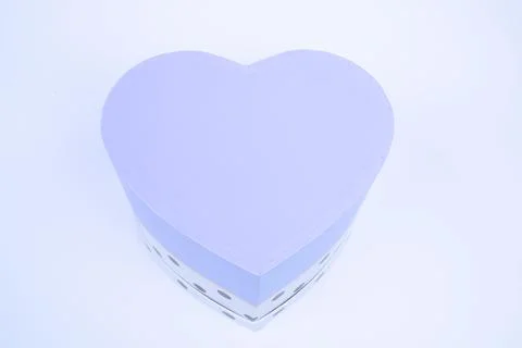 Gift box with a heart shape isolated on white background. Stock Photos