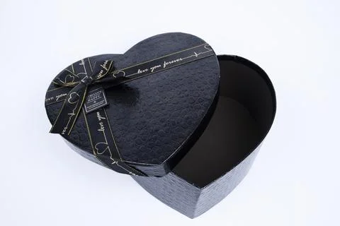 Gift box with a heart shape isolated on white background. Stock Photos