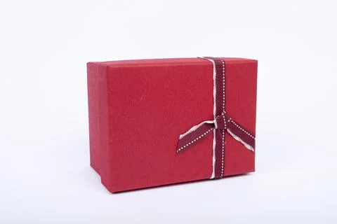 Gift box with a heart shape isolated on white background. Stock Photos