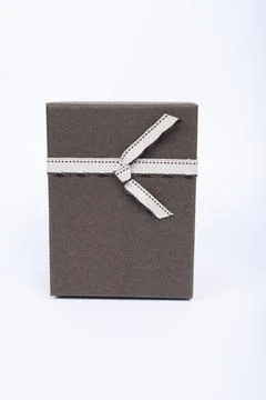 Gift box with a heart shape isolated on white background. Stock Photos