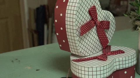 Gift box in the heart video red white with a bow Stock Footage 123684884
