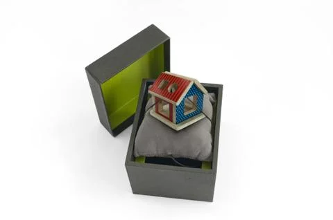 Gift box with house inside Stock Photos