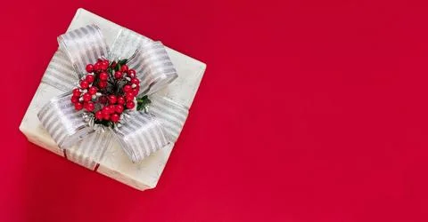 Gift box is isolated on a red background with copy space Stock Photos