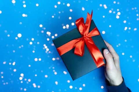 Gift box in mans hand Stock Photos