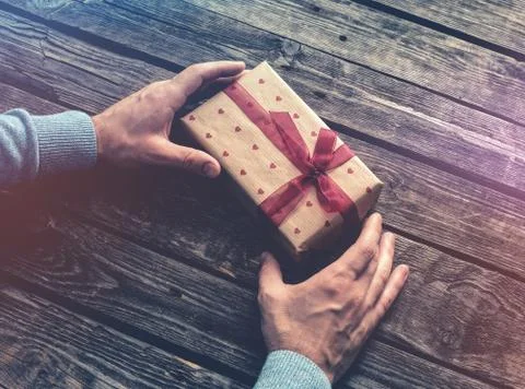 Gift box in man's hands. Fotos de archivo