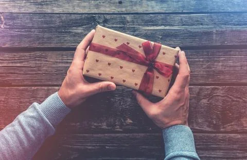 Gift box in man's hands. 写真素材