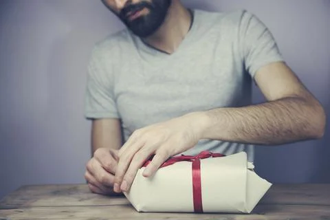 Gift box in man's hands Stock Photos