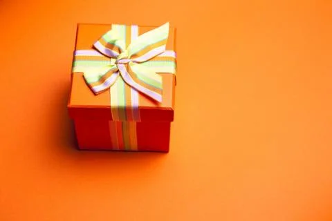 Gift Box On Orange Stock Photos