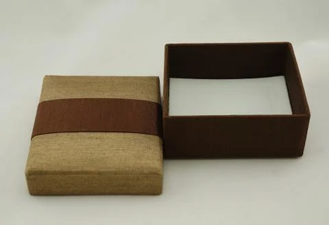 Gift box packaging with gold and brown color Stock Photos
