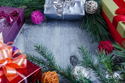 Gift box with pine branches on blue background Stock Photos