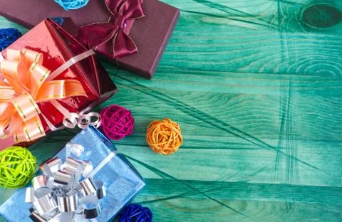 Gift box with pine branches on blue background view from above Stock Photos