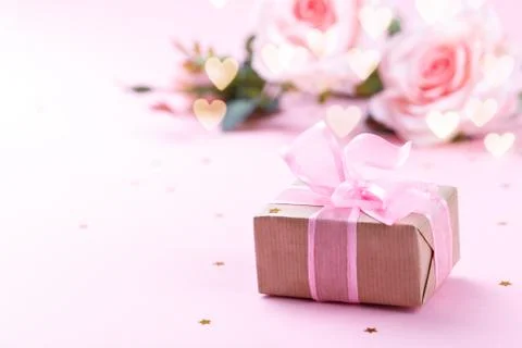 Gift box on pink background Stock Photos