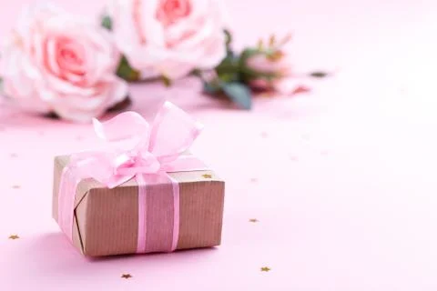 Gift box on pink background Stock Photos