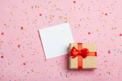 A gift in a box on a pink background Stock Photos