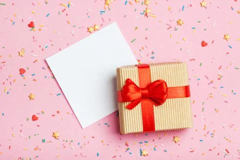 A gift in a box on a pink background Stock-Fotos