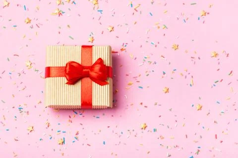 A gift in a box on a pink background Stock Photos