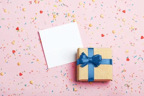 A gift in a box on a pink background Stock Photos
