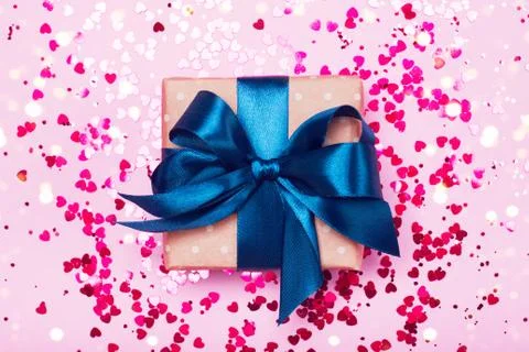 A gift in a box on a pink background Stock Photos