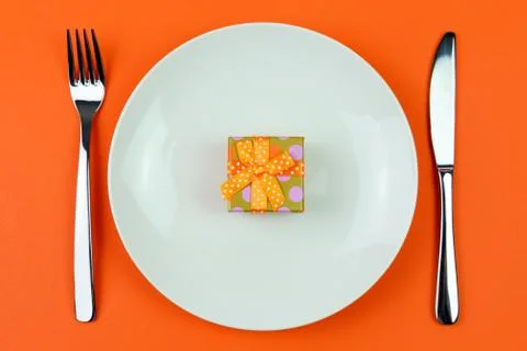 Gift box on a plate Stock Photos