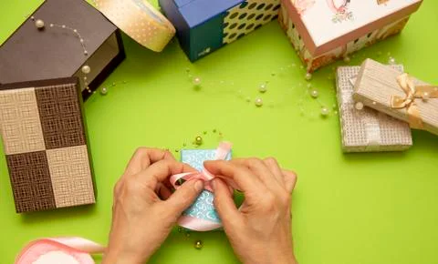Gift box preparation, workflow. on a green background, Happy valentines day, Stock Photos
