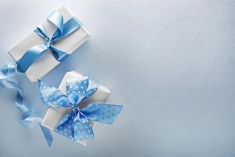 Gift box present on blue background Stock Photos