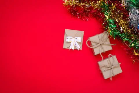 Gift Box on Red Background and Decoration Stock Photos