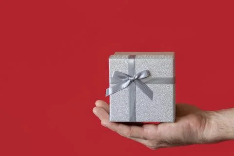 Gift box on a red background. Copy space. Holidays and events. Gift shop Stock Photos