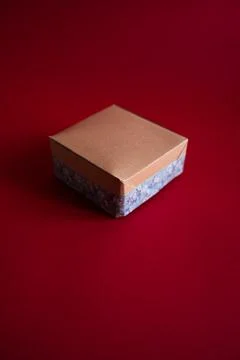 Gift box on a red background. Craft paper and handmade decoration 写真素材