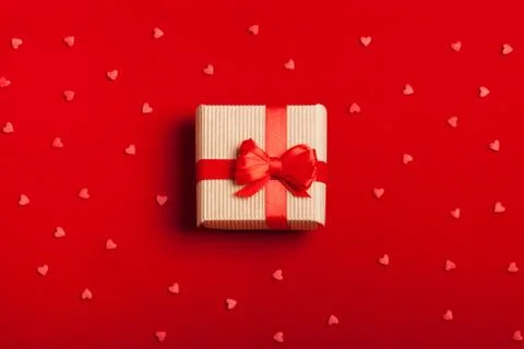 A gift in a box on a red background Stock-Fotos
