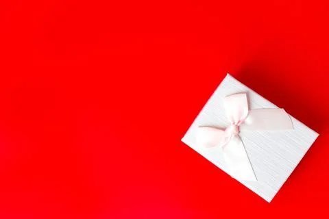Gift box on red background. Romantic st. Valentine's day concept of greetings Stock Photos