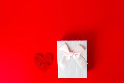 Gift box on red background. Romantic st. Valentine's day concept of greetings Stock Photos
