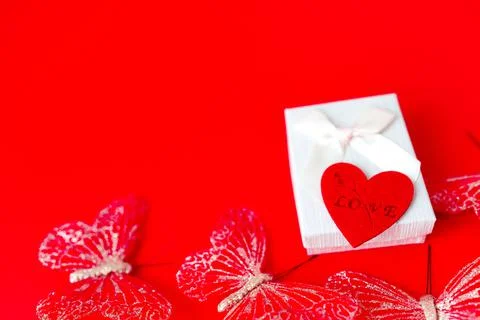 Gift box on red background. Romantic st. Valentine's day concept of greetings Stock Photos