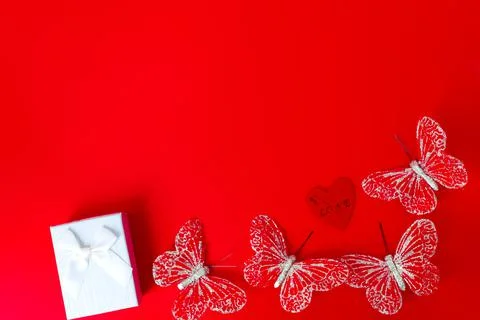 Gift box on red background. Romantic st. Valentine's day concept of greetings Stock Photos