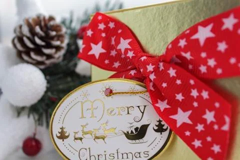 Gift box with red bow and merry christmas card Stock Photos