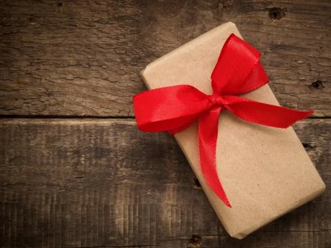 Gift box with a red bow Stock Photos