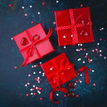 Gift box with red bow ribbon and heart Stock Photos