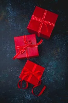 Gift box with red bow ribbon and heart Stock Photos