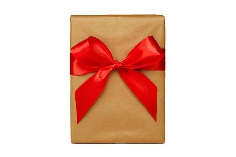 A gift box with a red bow stands on a white background. Isolate Stock Photos