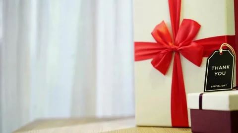 Gift box with red ribbon and thank you tag Stock Footage 333811169