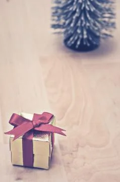 Gift box with red ribbon Stock Photos