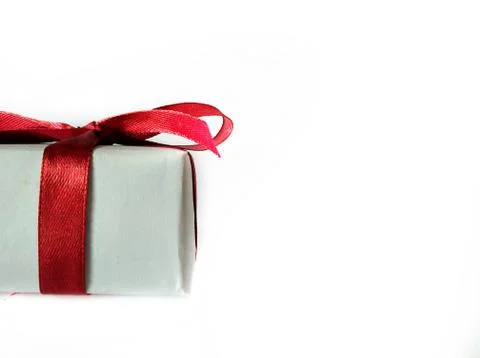 Gift box with red ribbon Stock Photos