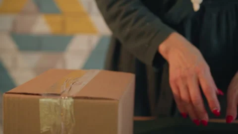 Gift box sealing. Securing cardboard box with scissors and tape techniques Stock Footage 333302672