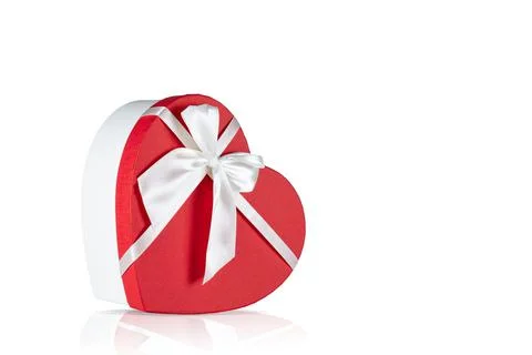 Gift box in the shape of a heart on a isolated white background. Stock Photos