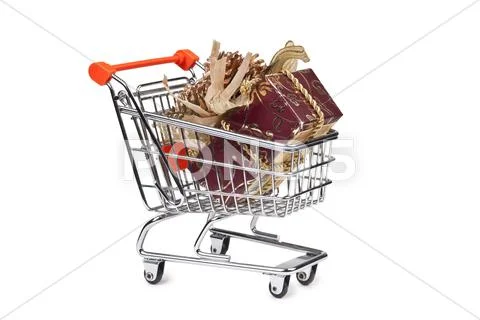 Gift box in shopping cart isolated Stock Photos