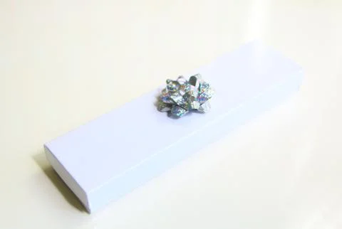 Gift box with silver ribbon bow isolated Illustration