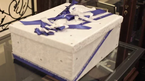 Gift box stands on the table Stock Footage 56722011