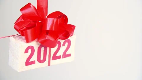 Gift box with text 2022 rotating on white background Stock Footage 161074622